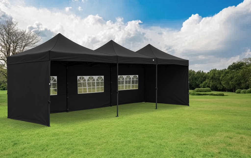Three linked black 3m x 3m gazebos with window and solid side panels