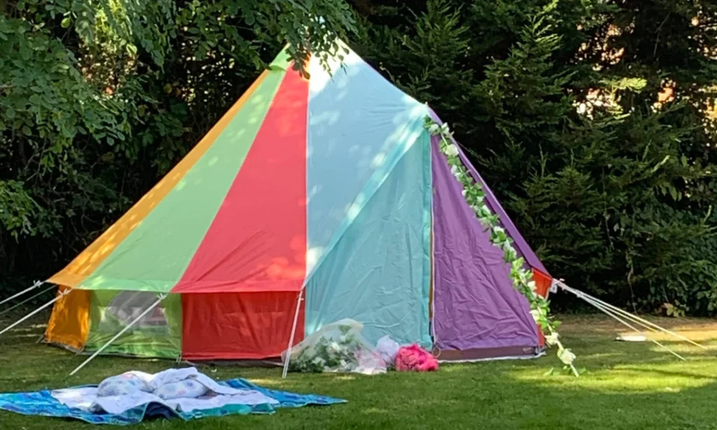Colourful 5m rainbow bell tent for garden party soft play hire